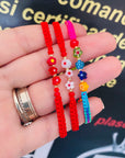 14k gold flower    and 2mm  beads  and string kids bracelet