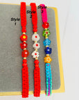 14k gold flower    and 2mm  beads  and string kids bracelet