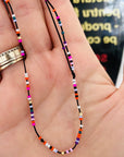 Ankle bracelet with 14k golf 2mm beadsx 5 and multicoloured small beads