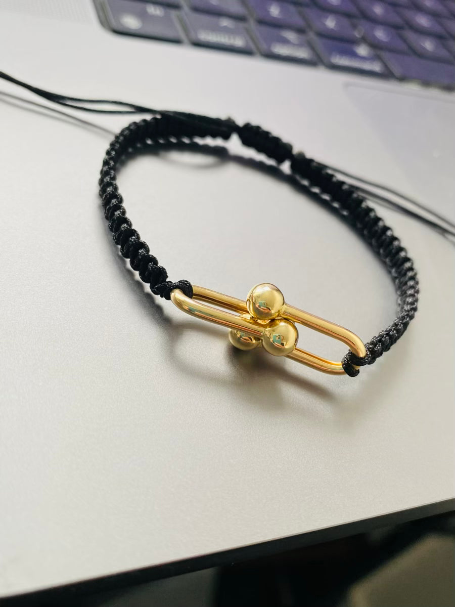 Black string with 14k gold middle large pendant bracelet